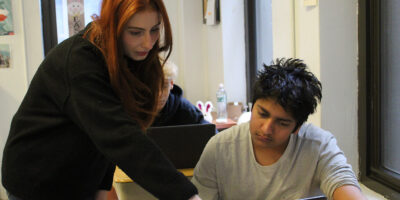 Teacher helping student with seat work 4 (1)